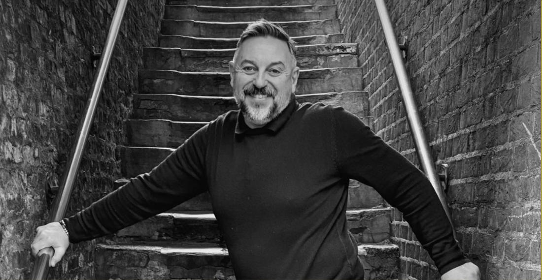 Kybor-standing-on-a-stone-staircase-in-Holborn-London. 