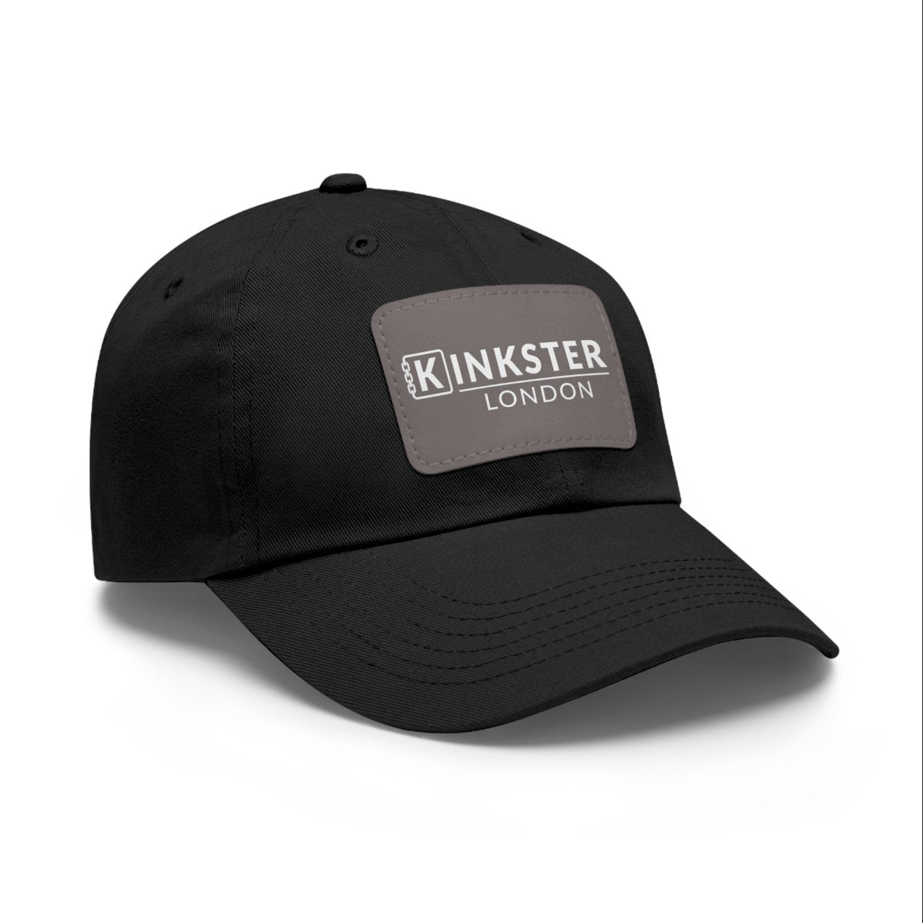 a-black-baseball-cap-with-kybor-kinkster-london-brand-on-a-warm-grey-faux-leather-patch