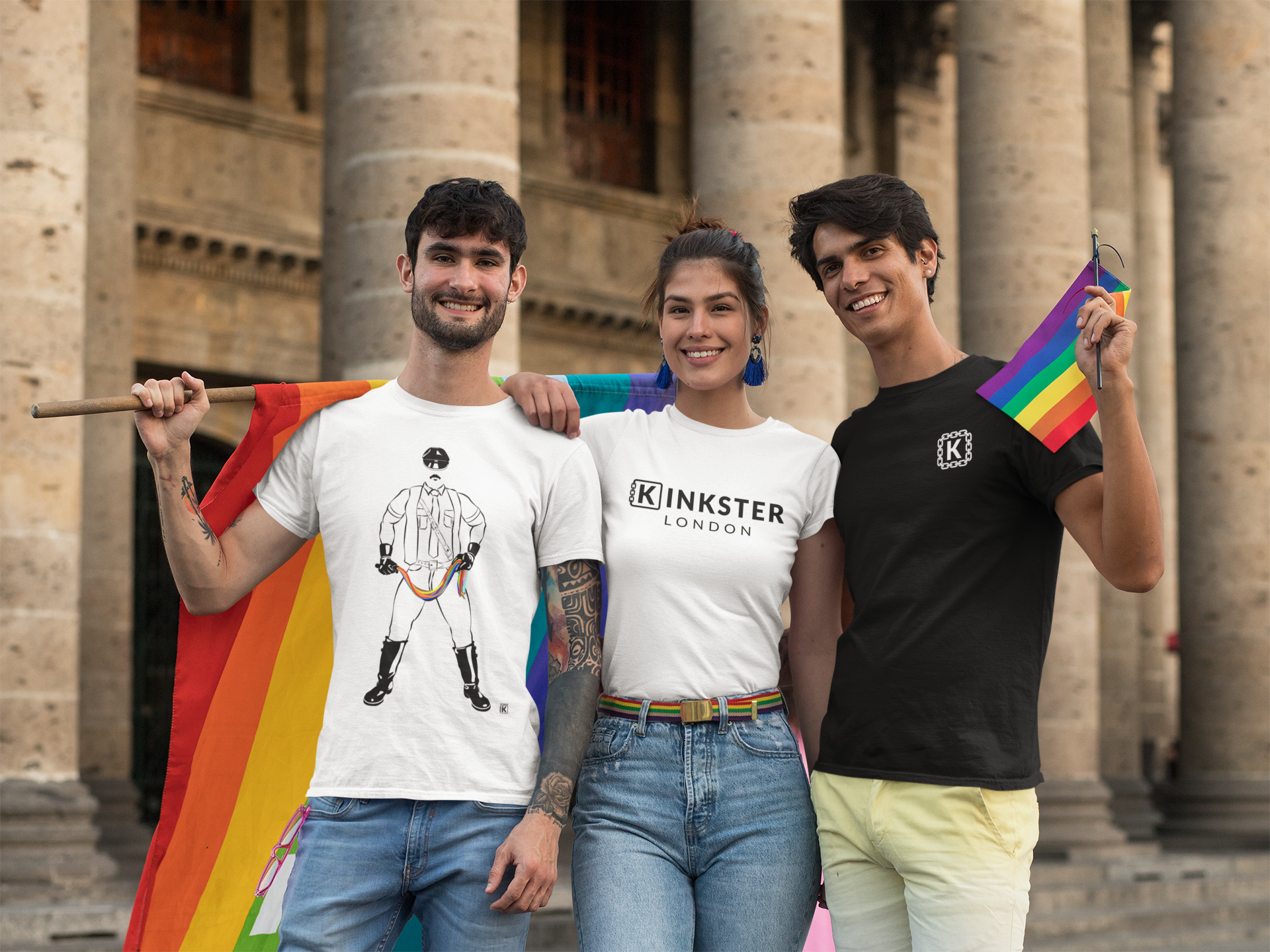 a-group-of-friends-all-wearing-kinkster-pride-t-shirts-holding-rainbow-flags