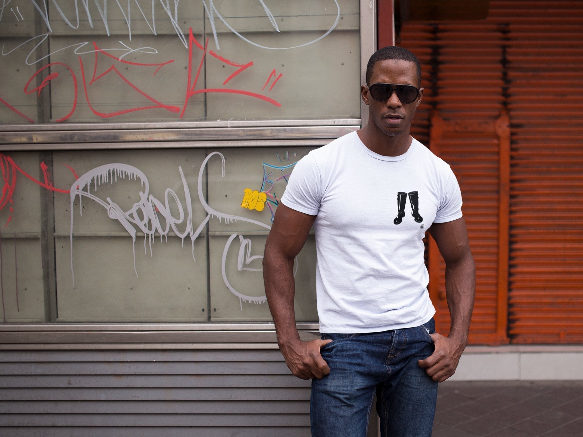 a-man-wearing-a-round-neck-tshirt-and-sunglasses-while-at-the-city