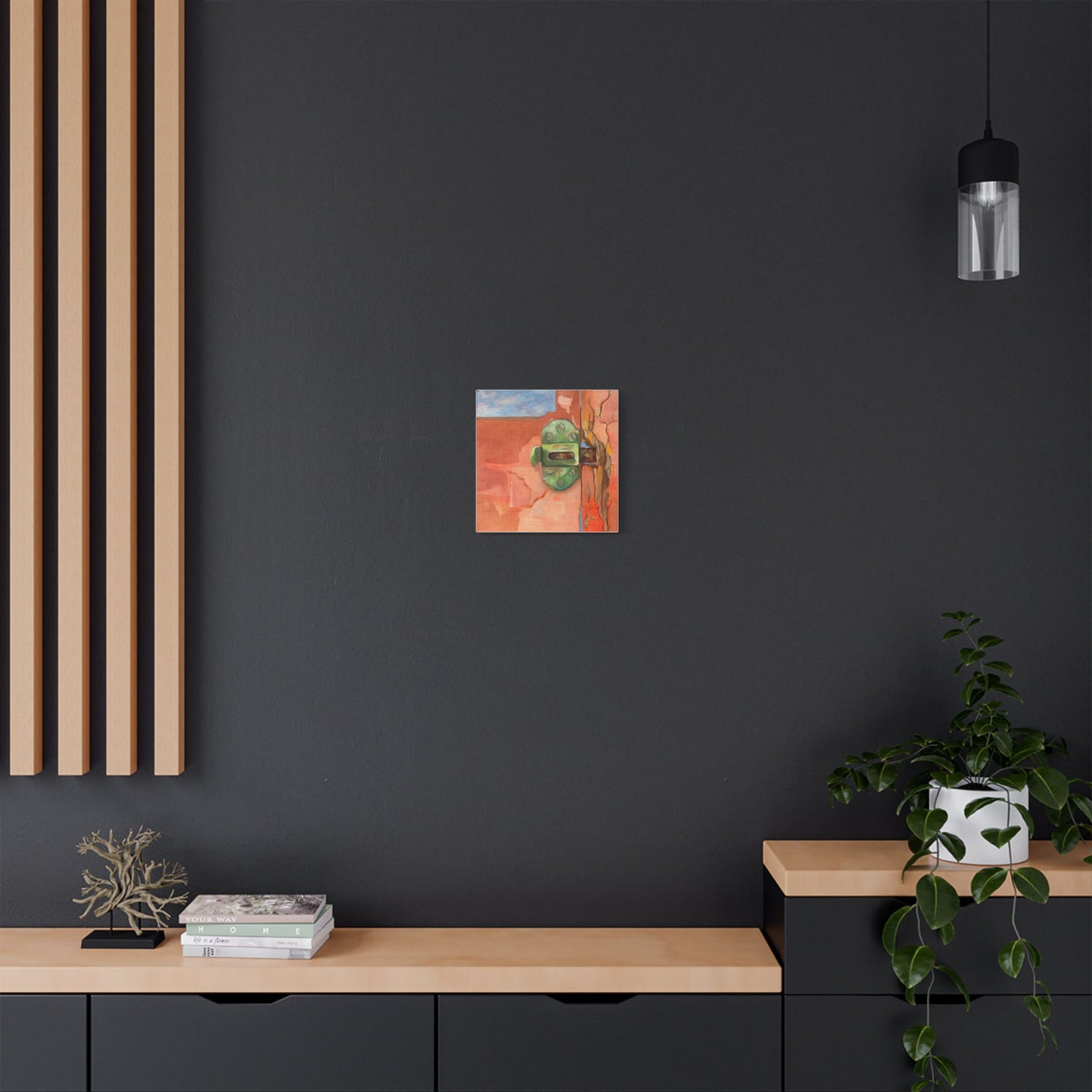 Painting of a window latch set on a dark wall in a modern interior.