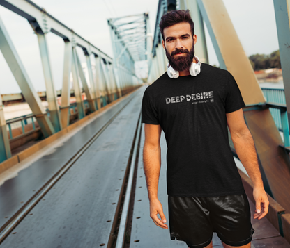 Man wearing a black t-shirt with 'DEEP DESIRE' text on a bridge