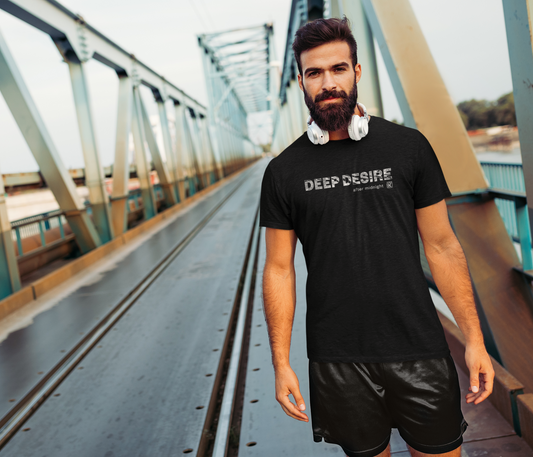 Man wearing a black t-shirt with 'DEEP DESIRE' text on a bridge